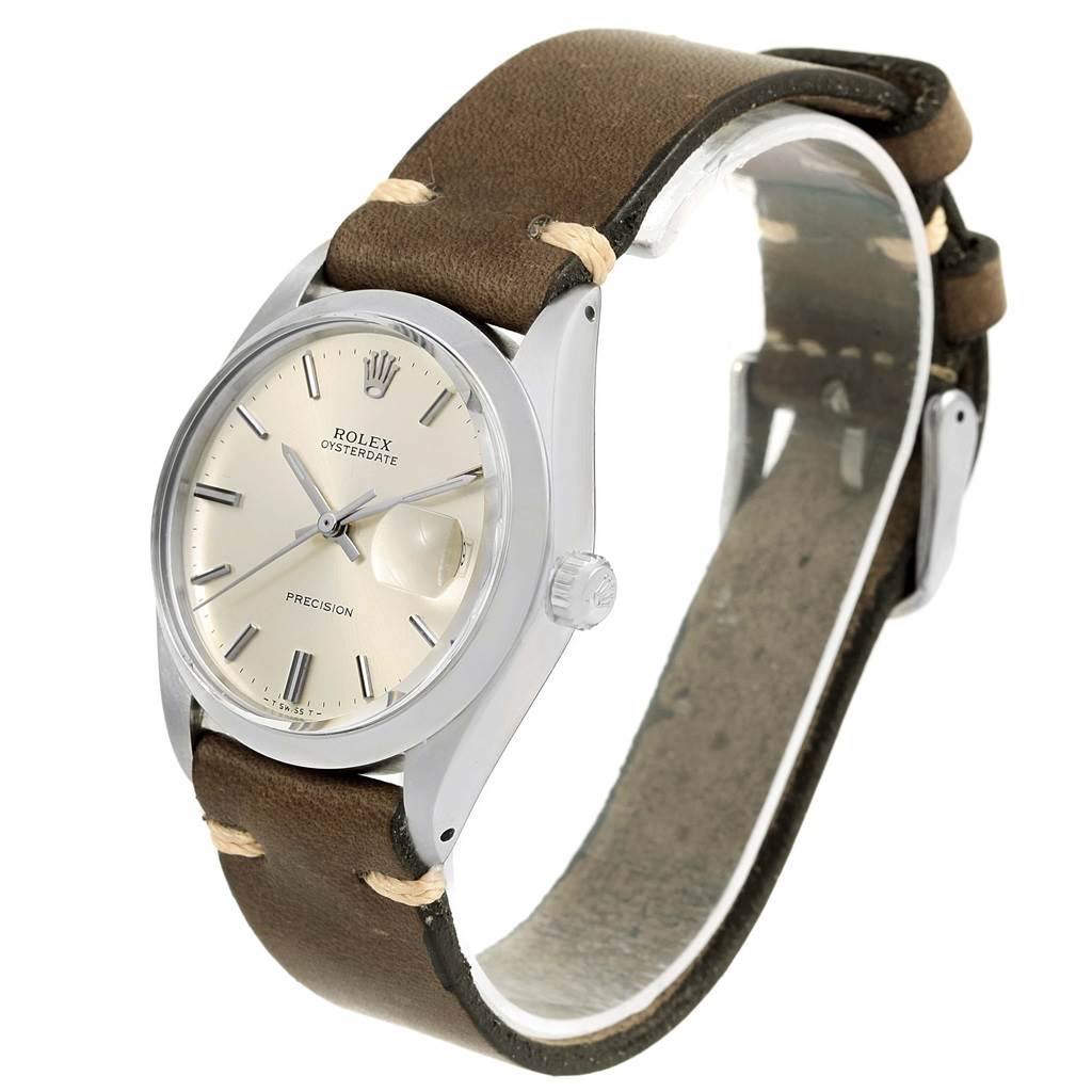The Rolex Vintage Collection 6694 Men's Stainless Steel Silver Dial 6694 Men's Stainless Steel Silver Dial watch is shown at an angle highlighting the face, case, crown, and leather strap.