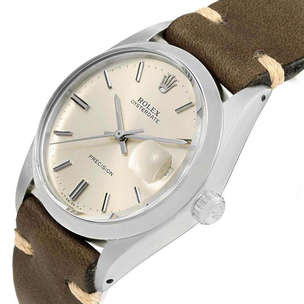 The image shows a Rolex Vintage Collection 6694 Men's Stainless Steel Silver Dial 6694 Men's Stainless Steel Silver Dial watch at a slight angle, highlighting the dial, bezel, and part of the leather strap.