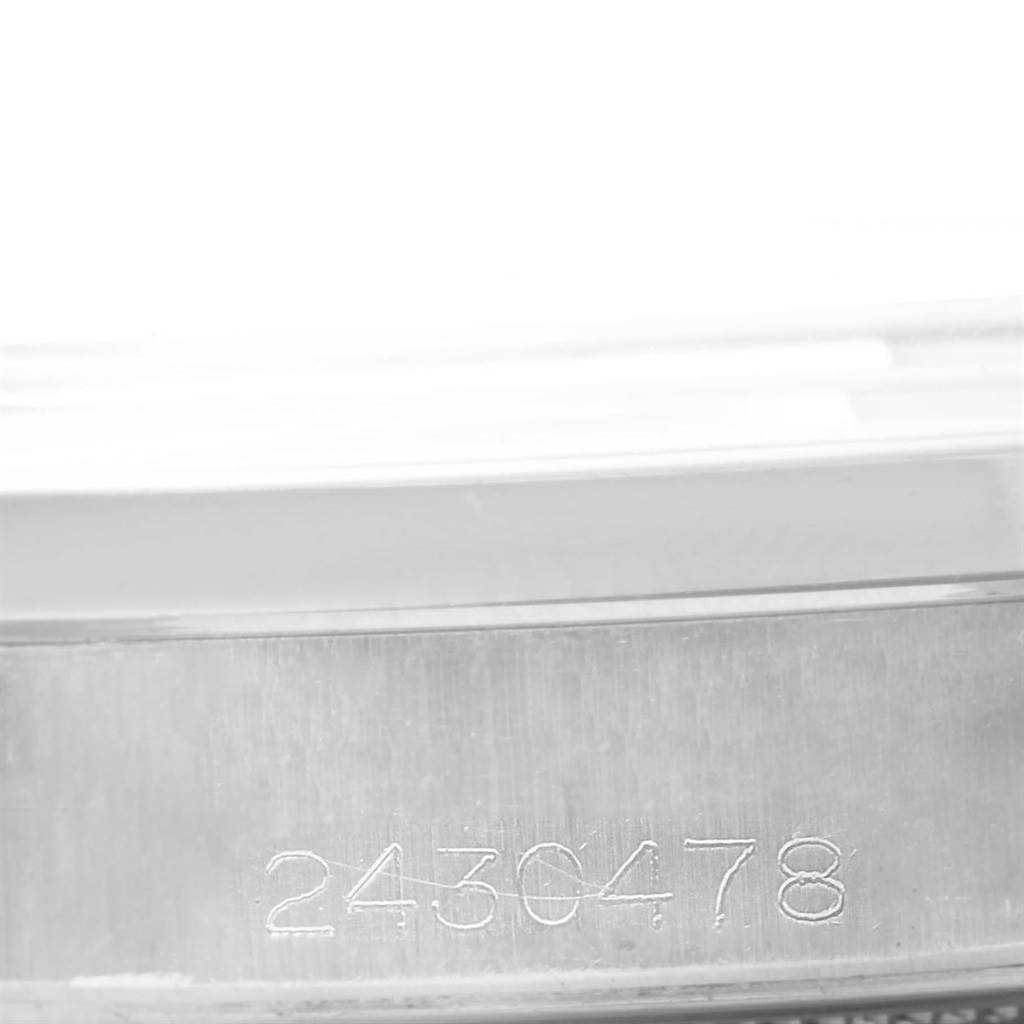 The image shows a close-up of the serial number engraving on the side of the case of a Vintage Collection model by Rolex.