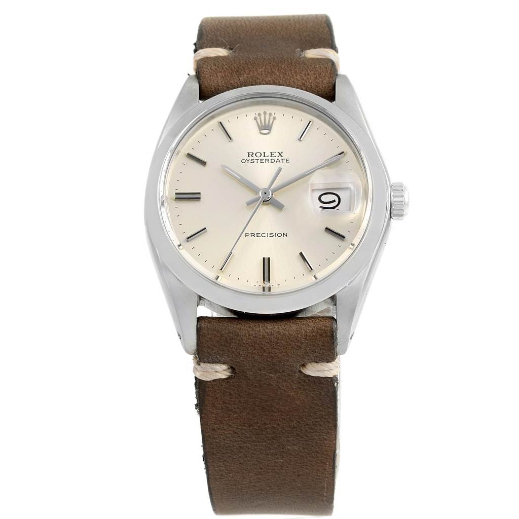 The Vintage Collection Rolex Oysterdate watch is shown from a front angle, displaying the dial, crown, and brown leather strap.