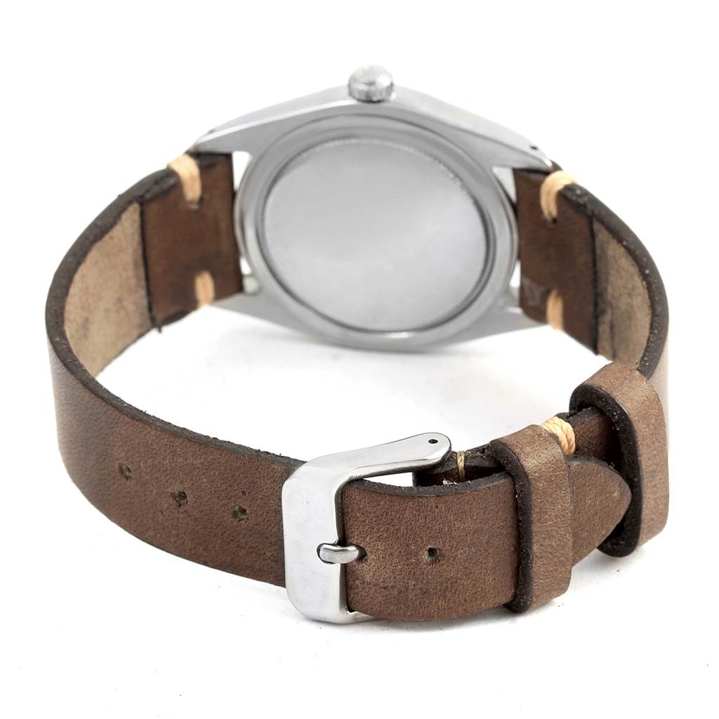 This image shows the back case and leather strap of a Rolex Vintage Collection 6694 Men's Stainless Steel Silver Dial 6694 Men's Stainless Steel Silver Dial model at an angle.