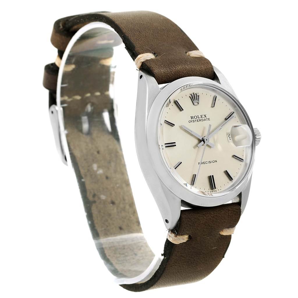The Rolex Vintage Collection 6694 Men's Stainless Steel Silver Dial 6694 Men's Stainless Steel Silver Dial model watch is shown from a three-quarter angle, highlighting the beige dial and brown leather strap.