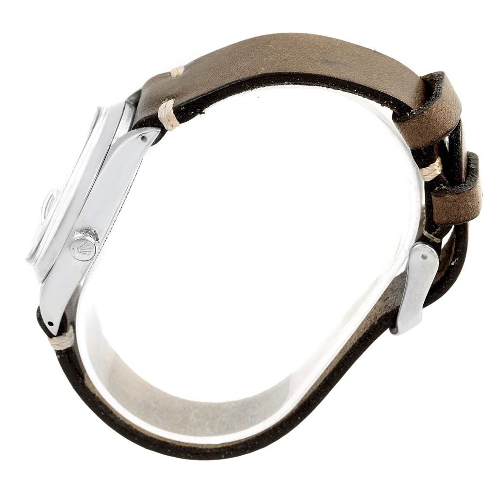 The Rolex Vintage Collection 6694 Men's Stainless Steel Silver Dial 6694 Men's Stainless Steel Silver Dial watch is shown in a side view, highlighting its leather strap and metal case.