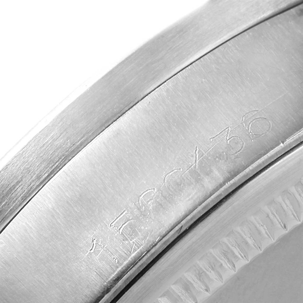 The image shows a close-up of the case side of a Rolex Vintage Collection 1501 Men's Stainless Steel Silver Dial 1501 Men's Stainless Steel Silver Dial model, featuring its engraved serial number.