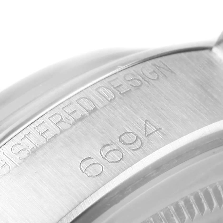 This image shows a close-up of the case back with the engraved serial number on the Rolex Vintage Collection 6694 Men's Stainless Steel Blue Dial 6694 Men's Stainless Steel Blue Dial model.