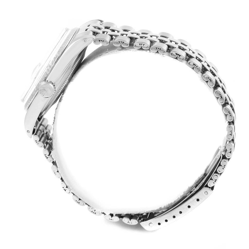 This side view of a Vintage Collection Rolex watch shows its case, bracelet, and crown.