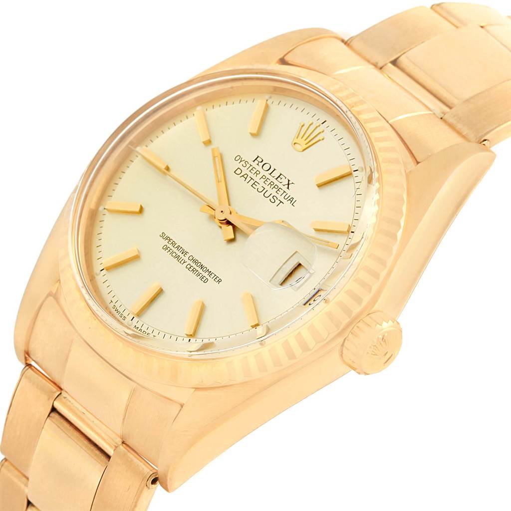 The Rolex Vintage Collection 1601 Men's Yellow Gold Silver Dial 1601 Men's Yellow Gold Silver Dial model watch is shown at a tilted angle, displaying the dial, crown, and partial bracelet.