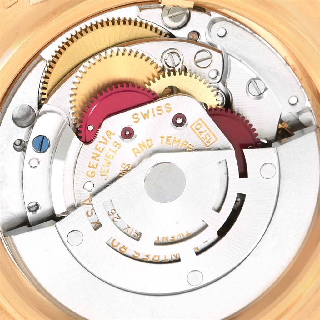 The image shows the internal movement and gears of a Vintage Collection Rolex watch.