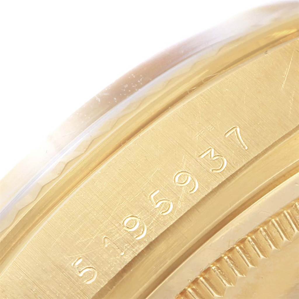 This image shows a close-up of the serial number on the side of a Rolex Vintage Collection 1601 Men's Yellow Gold Silver Dial 1601 Men's Yellow Gold Silver Dial model's case.