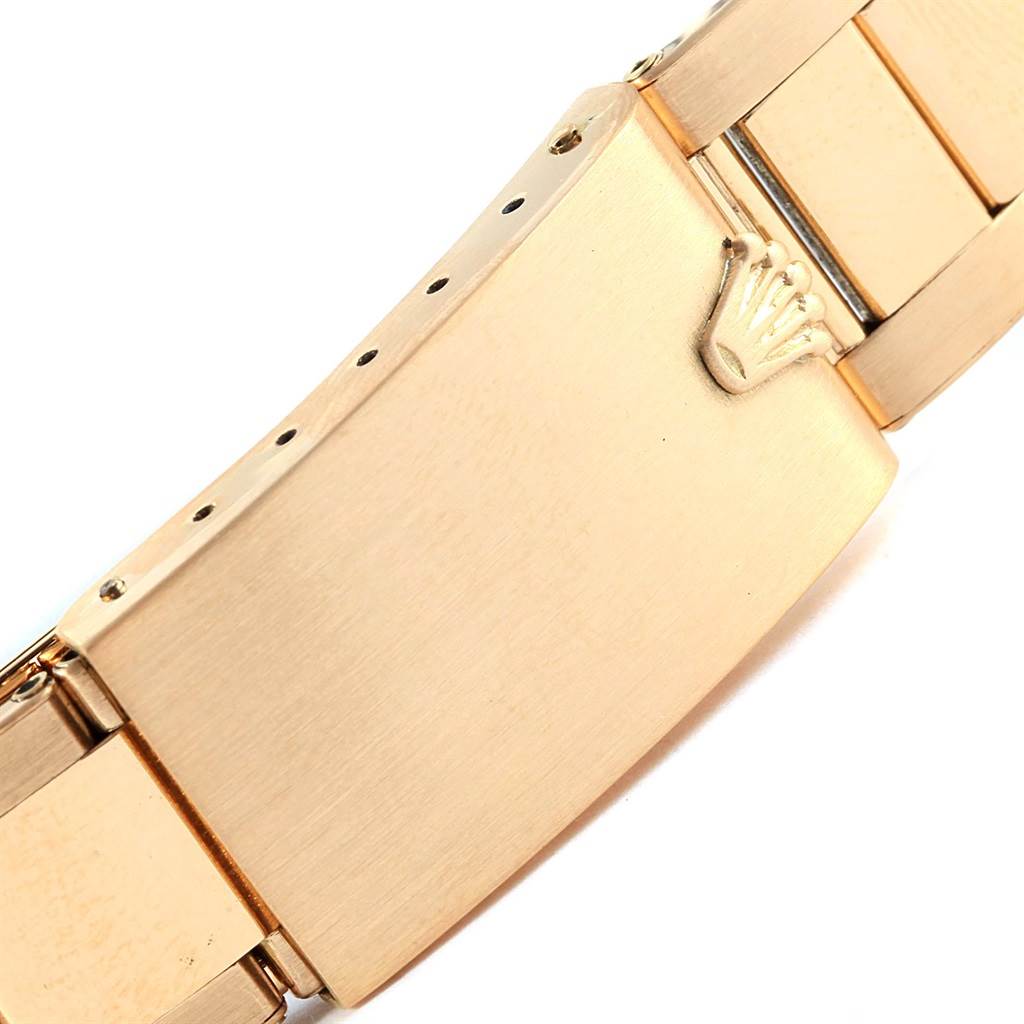 This image shows the clasp of a Rolex Vintage Collection 1601 Men's Yellow Gold Silver Dial 1601 Men's Yellow Gold Silver Dial watch, featuring the Rolex crown logo.