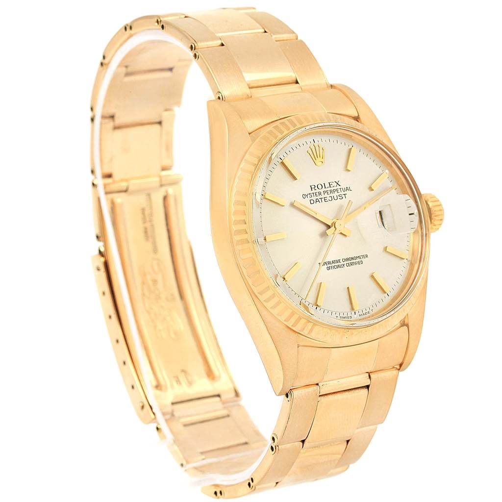 This image shows a side view of the Rolex Vintage Collection 1601 Men's Yellow Gold Silver Dial 1601 Men's Yellow Gold Silver Dial Datejust watch, highlighting the face, band, and crown.