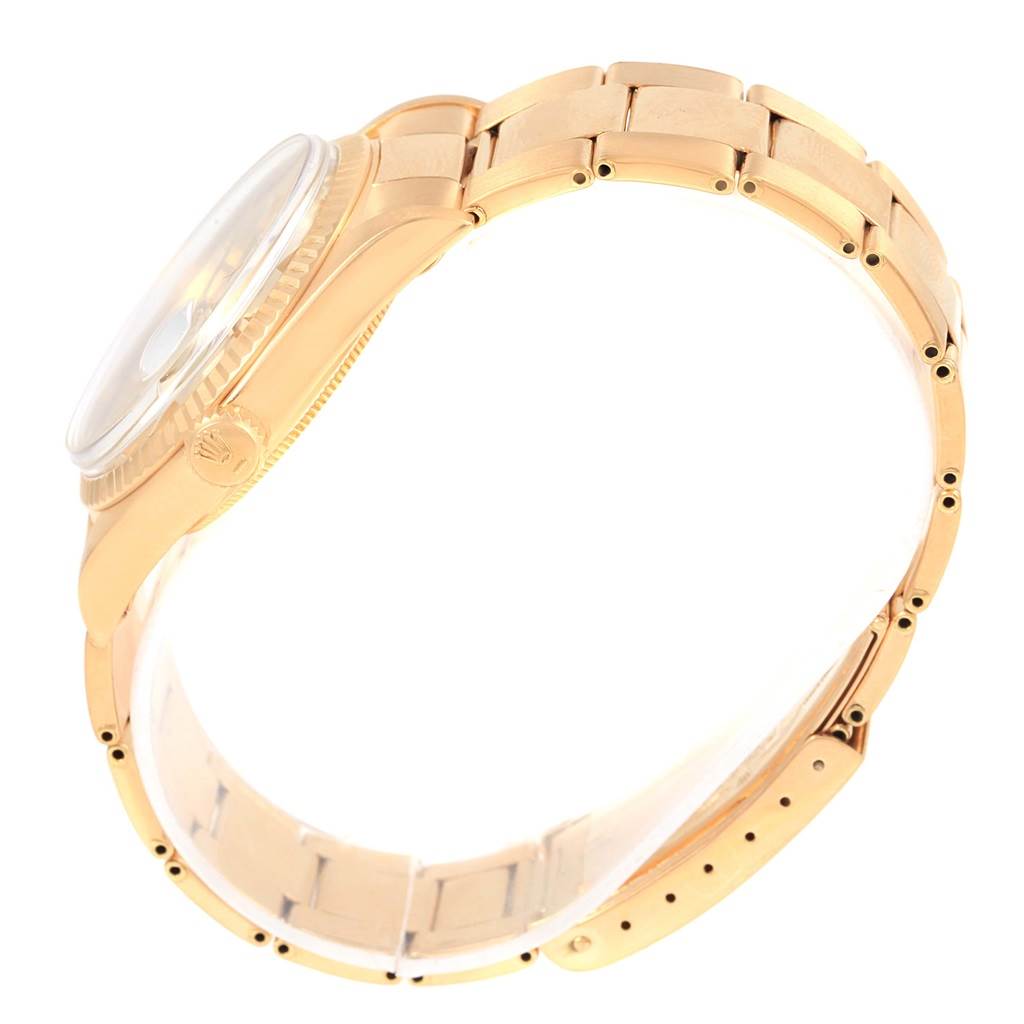 The image shows a side view of the Rolex Vintage Collection 1601 Men's Yellow Gold Silver Dial 1601 Men's Yellow Gold Silver Dial model, highlighting its case, crown, and bracelet.