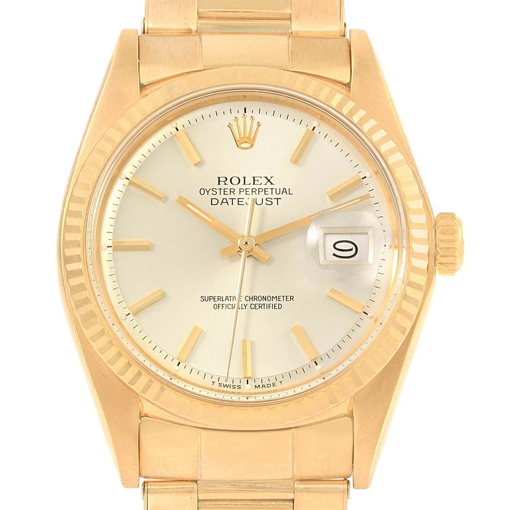 This is a close-up image of the Rolex Vintage Collection 1601 Men's Yellow Gold Silver Dial 1601 Men's Yellow Gold Silver Dial Oyster Perpetual Datejust watch, showcasing the face, crown, and part of the bracelet.