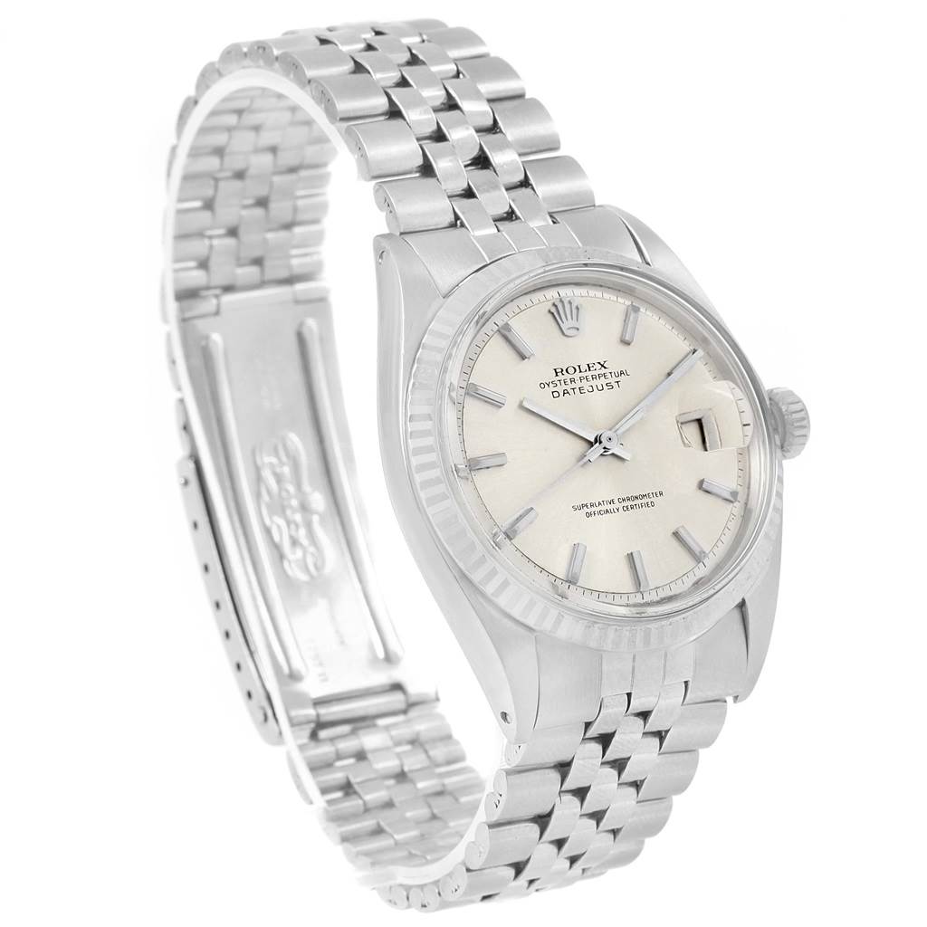 The image shows a side view of the Rolex Vintage Collection 1601 Men's Stainless Steel Silver Dial 1601 Men's Stainless Steel Silver Dial watch, highlighting its dial, crown, and Jubilee bracelet.