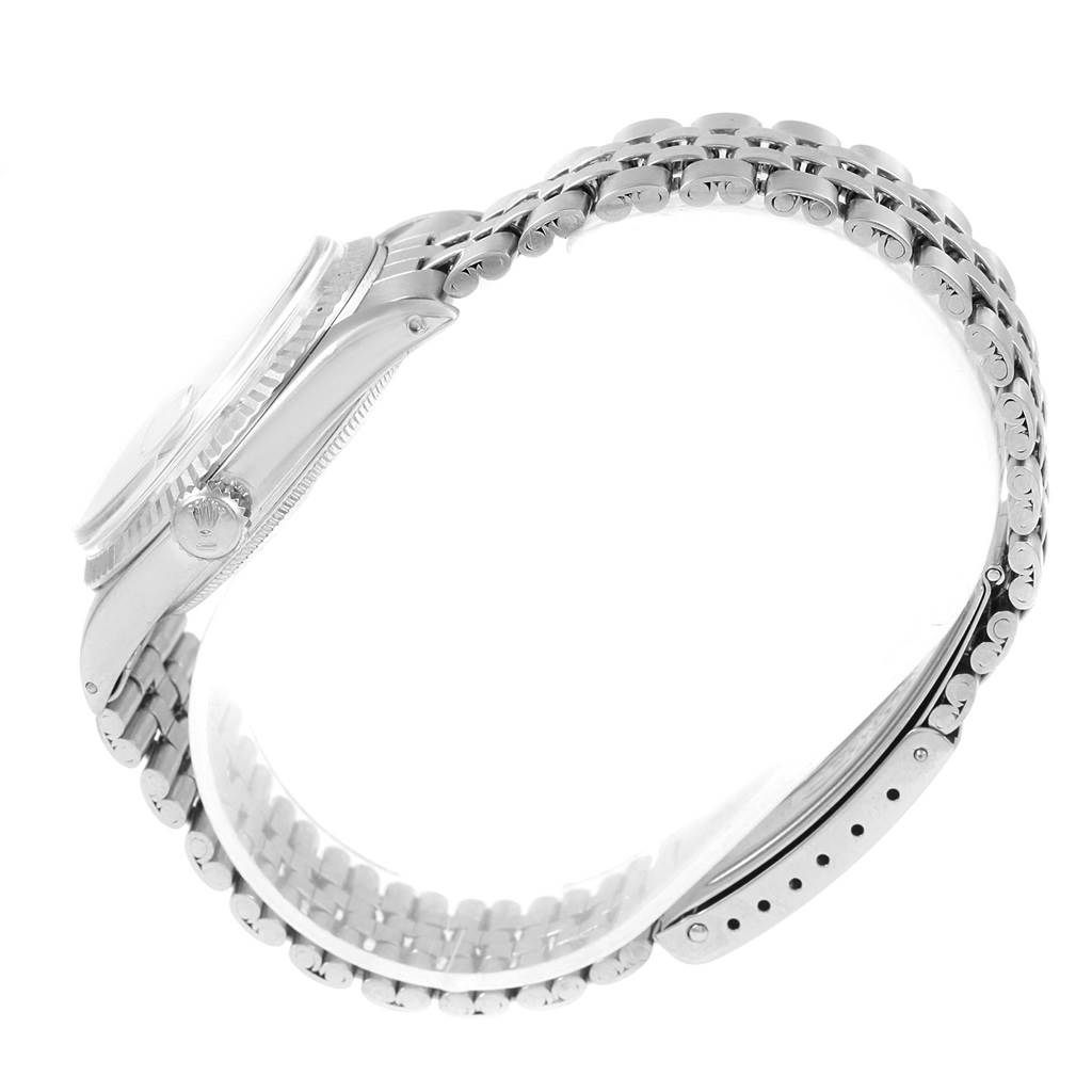 The image shows a side view of the Rolex Vintage Collection 1601 Men's Stainless Steel Silver Dial 1601 Men's Stainless Steel Silver Dial model, highlighting the watch case, crown, and bracelet.