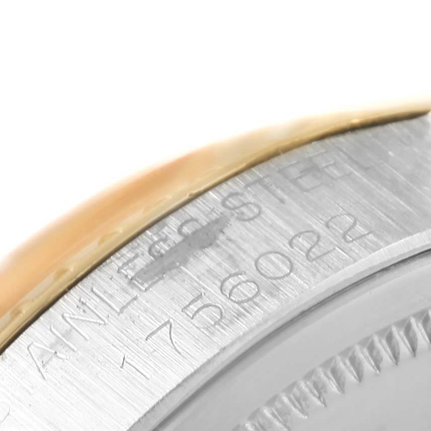 This is a close-up of the side engraving on a Rolex Vintage Collection 1505 Men's Stainless Steel Champagne Dial 1505 Men's Stainless Steel Champagne Dial model watch, showing part of its case and bezel.