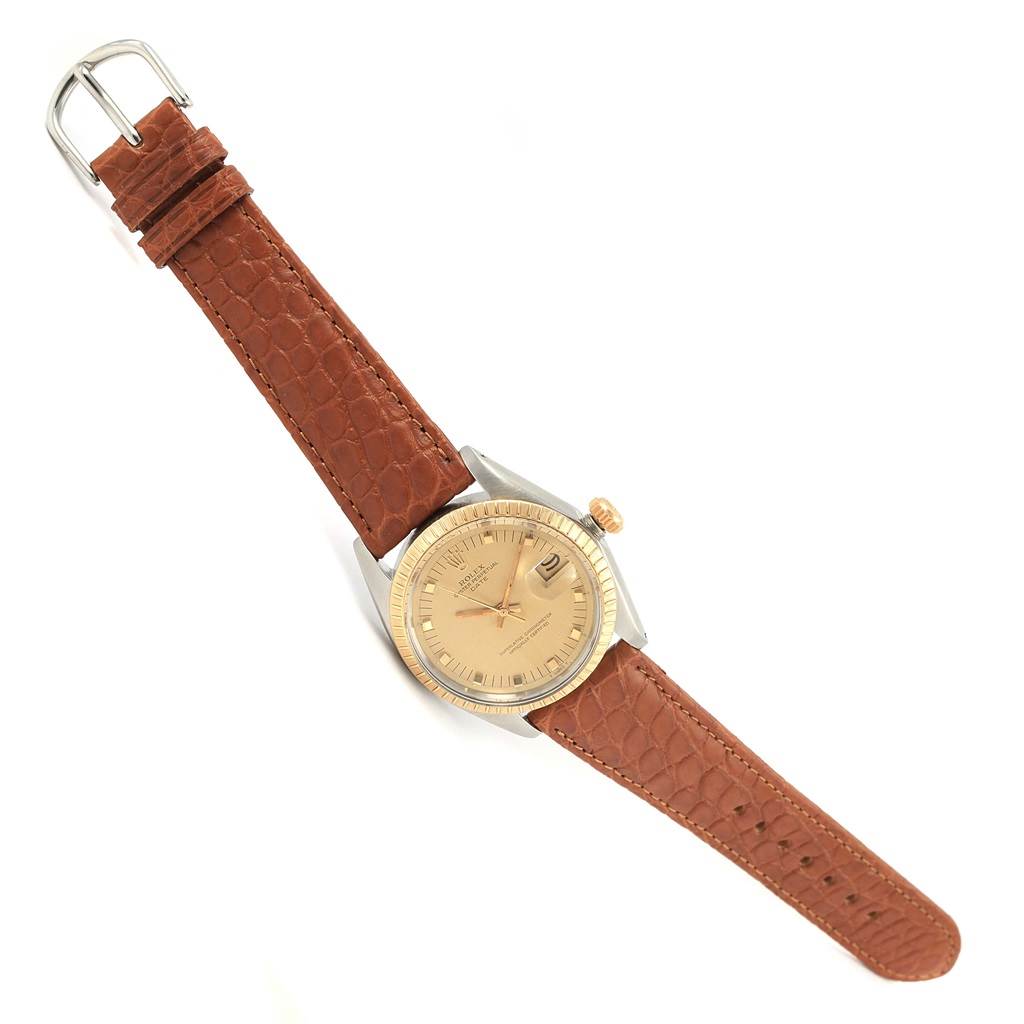 The image shows a top-down angle of a Rolex Vintage Collection 1505 Men's Stainless Steel Champagne Dial 1505 Men's Stainless Steel Champagne Dial watch with a brown leather strap and gold dial.