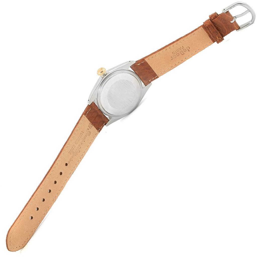 The image shows the back view of a Rolex Vintage Collection 1505 Men's Stainless Steel Champagne Dial 1505 Men's Stainless Steel Champagne Dial watch with a brown leather strap and a silver buckle.