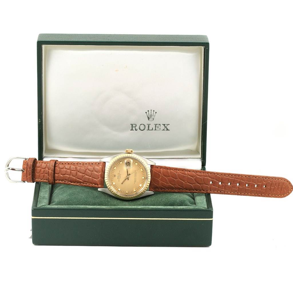 The Vintage Collection Rolex watch is shown from the front, with the full face, strap, and buckle visible, placed inside its open box.