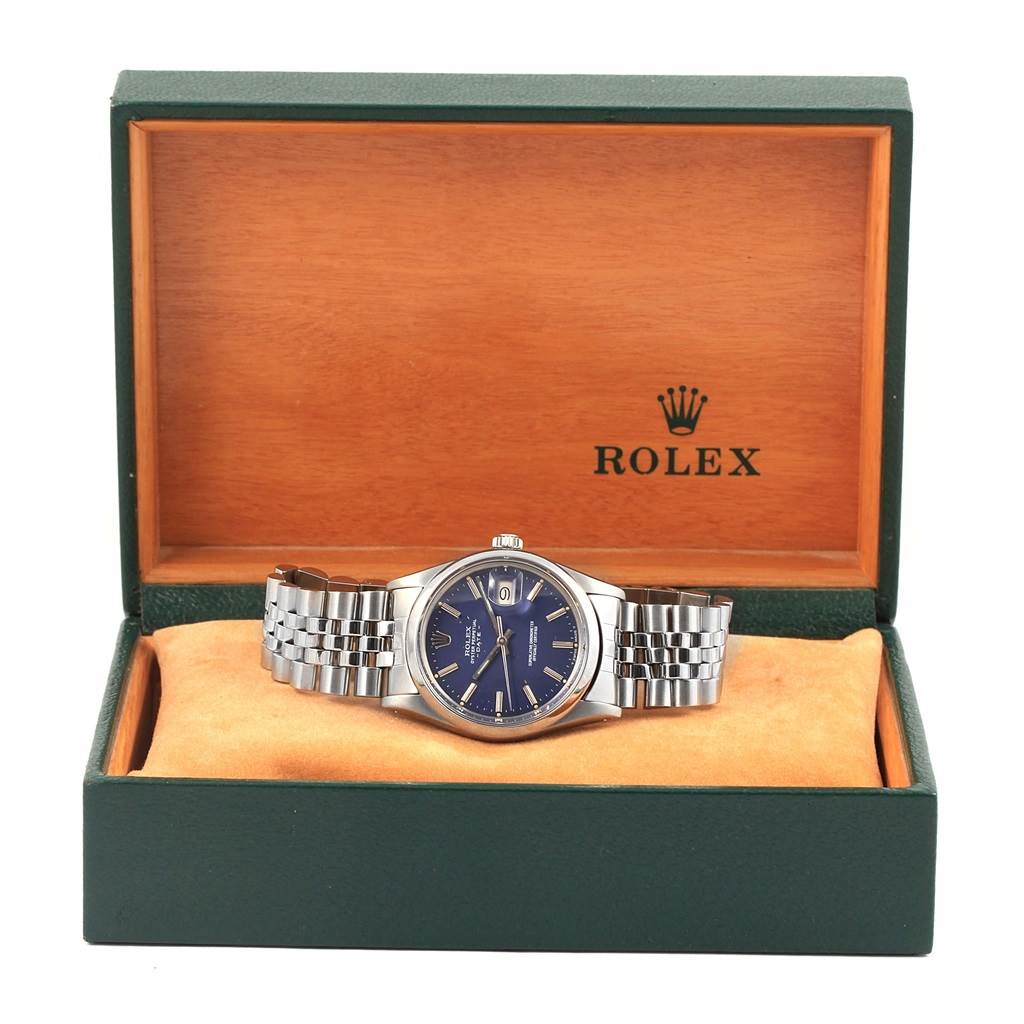 The Rolex Vintage Collection 15000 Men's Stainless Steel Blue Dial 15000 Men's Stainless Steel Blue Dial watch is shown front-facing in its open green and wood-colored case.