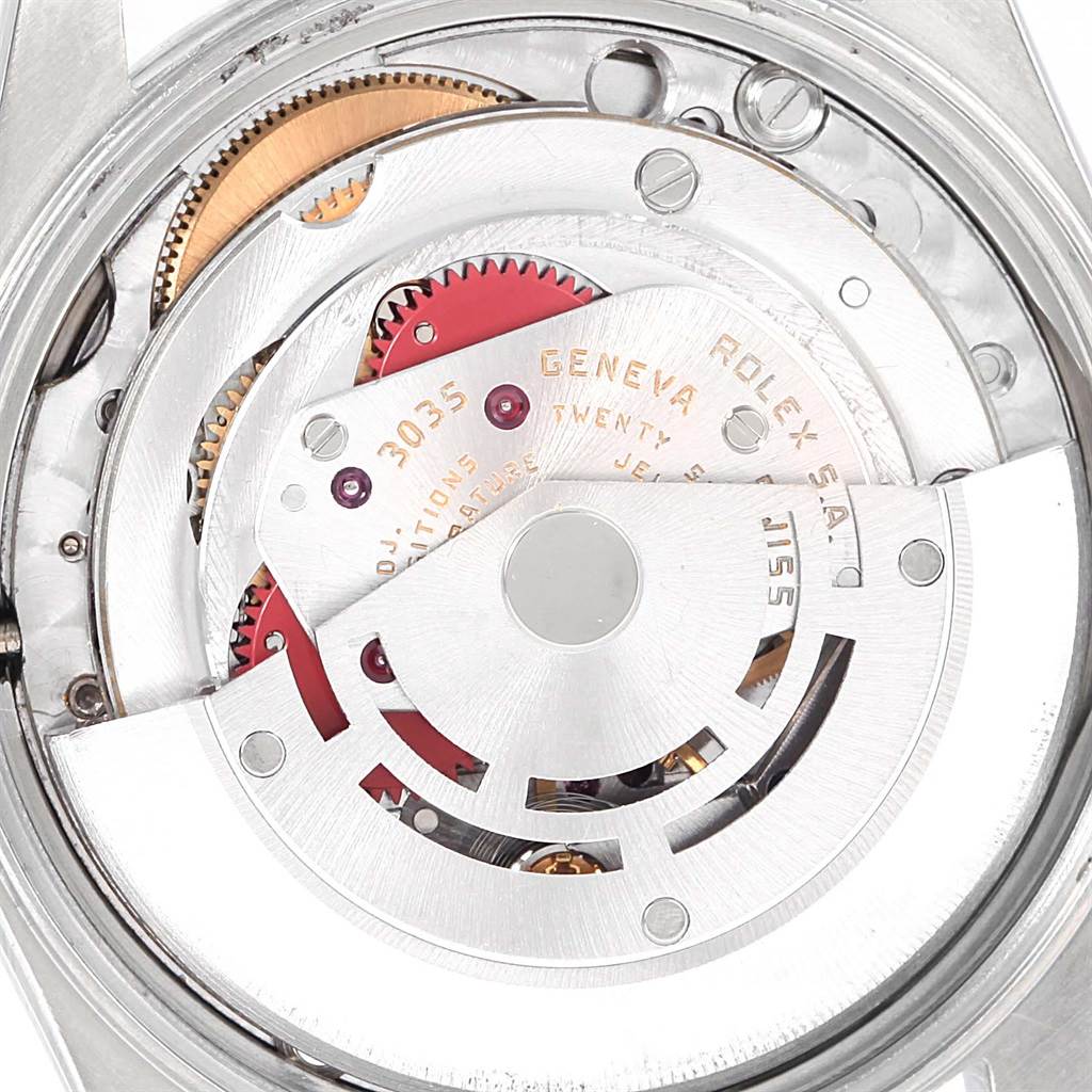 This image shows the intricate internal mechanism of the Rolex Vintage Collection 15000 Men's Stainless Steel Blue Dial 15000 Men's Stainless Steel Blue Dial model, focusing on its gears and rotor.