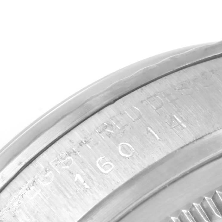 This close-up image shows the engraved bezel with the serial number on a Rolex Vintage Collection 16014 Men's Stainless Steel Silver Dial 16014 Men's Stainless Steel Silver Dial watch.