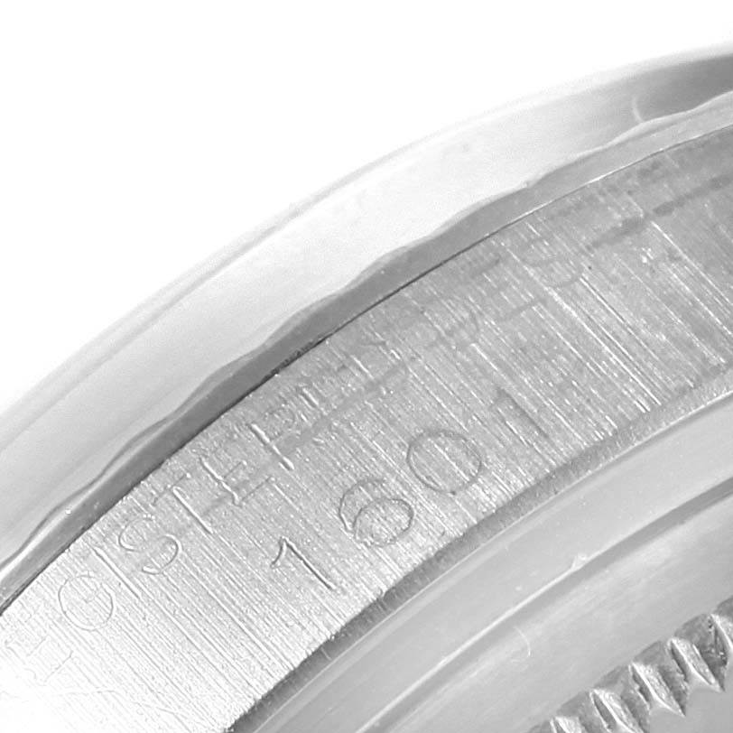 This close-up image shows the engraved bezel of the Rolex Vintage Collection 1601 Men's Stainless Steel Silver Dial 1601 Men's Stainless Steel Silver Dial model.