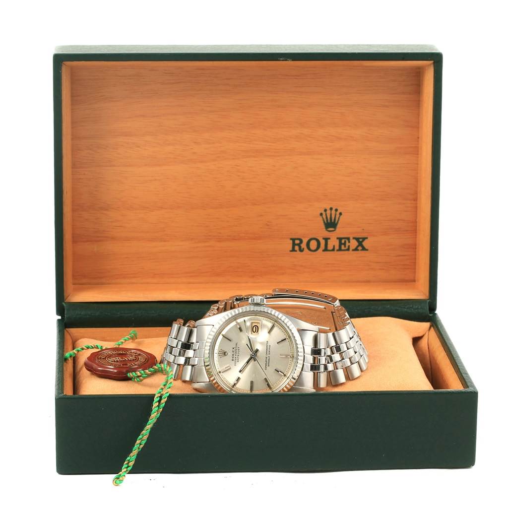 The image shows a Rolex Vintage Collection 1601 Men's Stainless Steel Silver Dial 1601 Men's Stainless Steel Silver Dial watch displayed in an open green and tan Rolex box.
