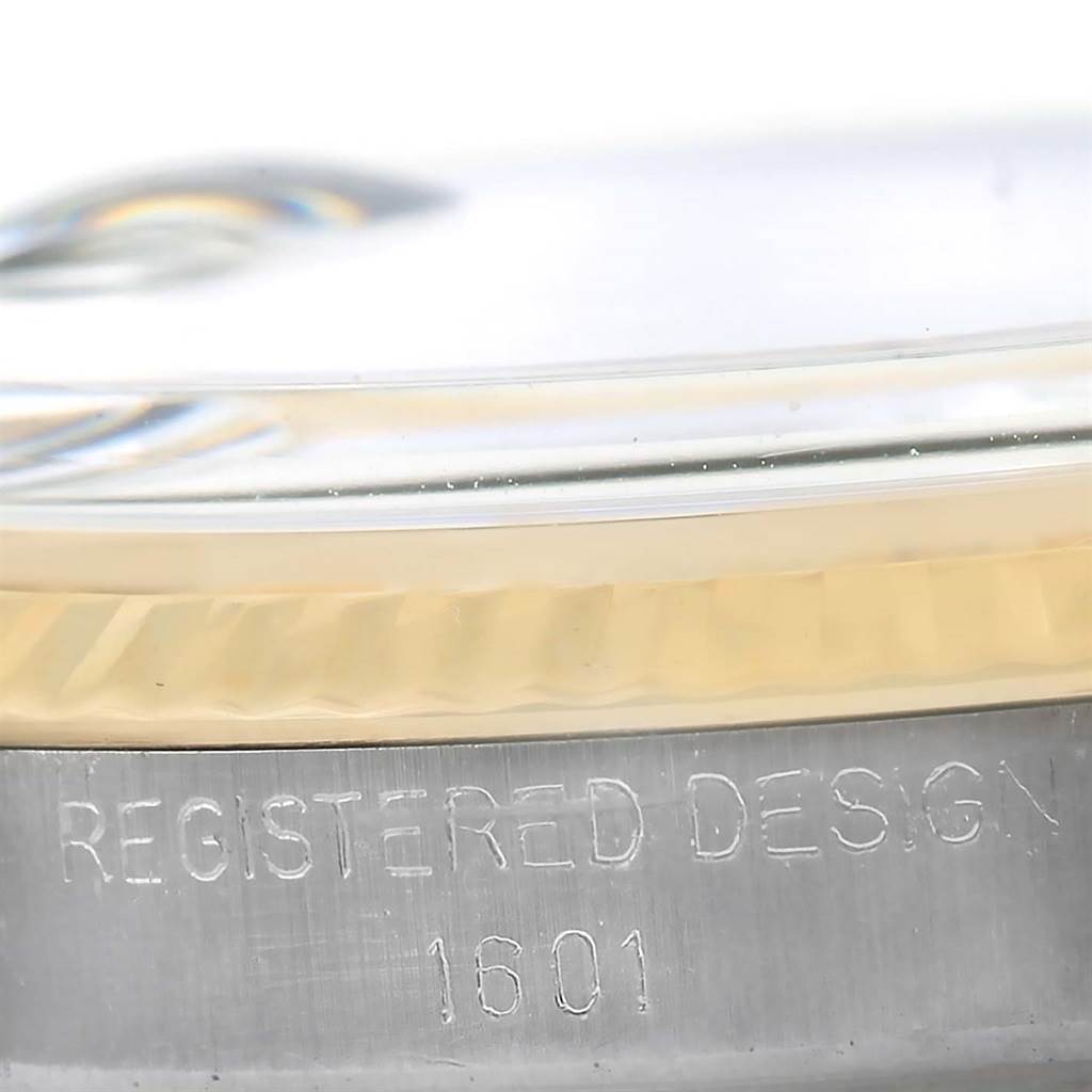 This close-up image shows the side view of the case and bezel of the Rolex Vintage Collection 1601 Men's Stainless Steel Silver Dial 1601 Men's Stainless Steel Silver Dial model, featuring the "REGISTERED DESIGN 1601" engraving.