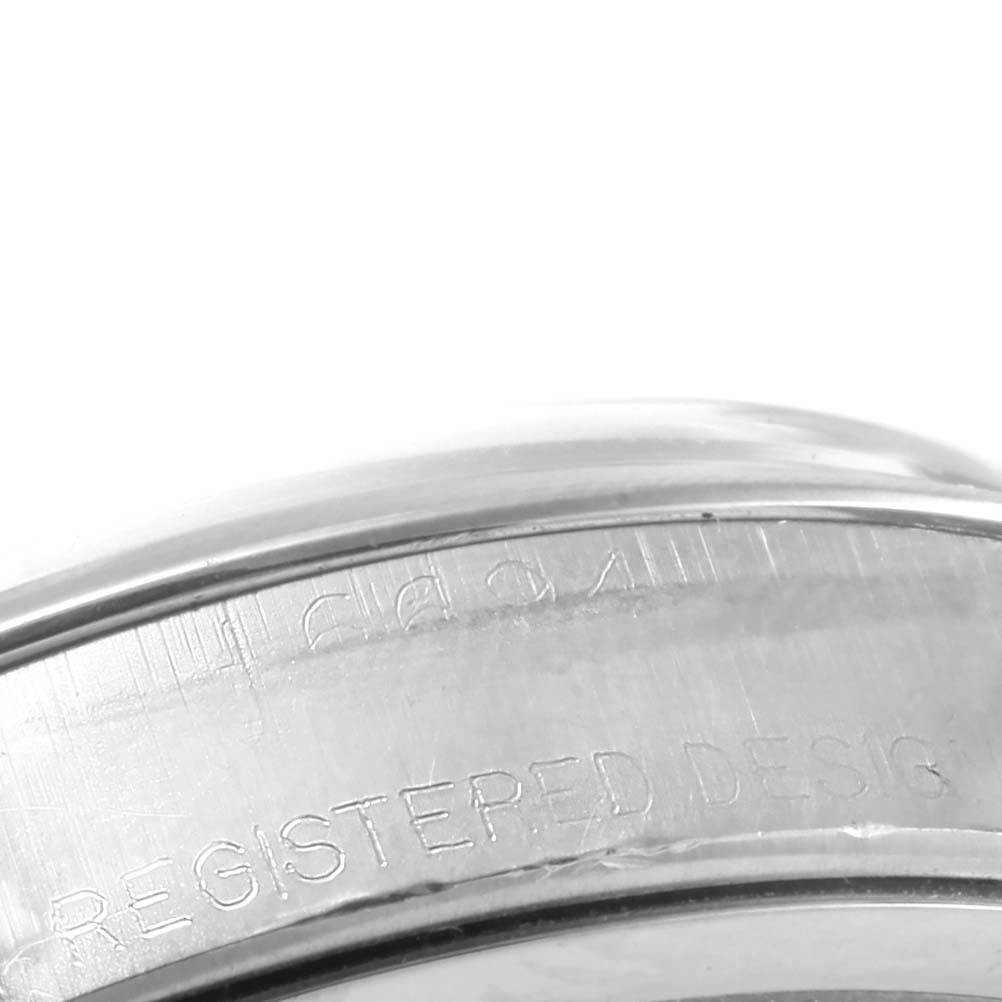 This close-up image shows the engraved side of the case of a Vintage Collection model by Rolex.