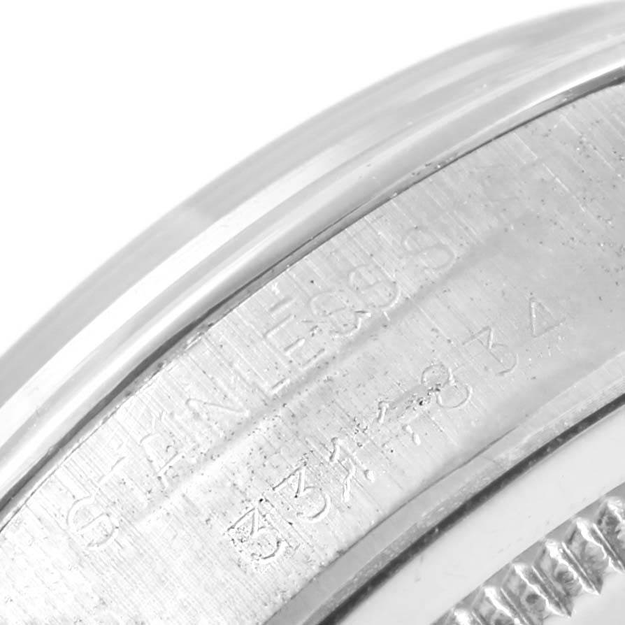 The image shows a close-up of the side detailing and engravings on the bezel of a Vintage Collection model by Rolex.