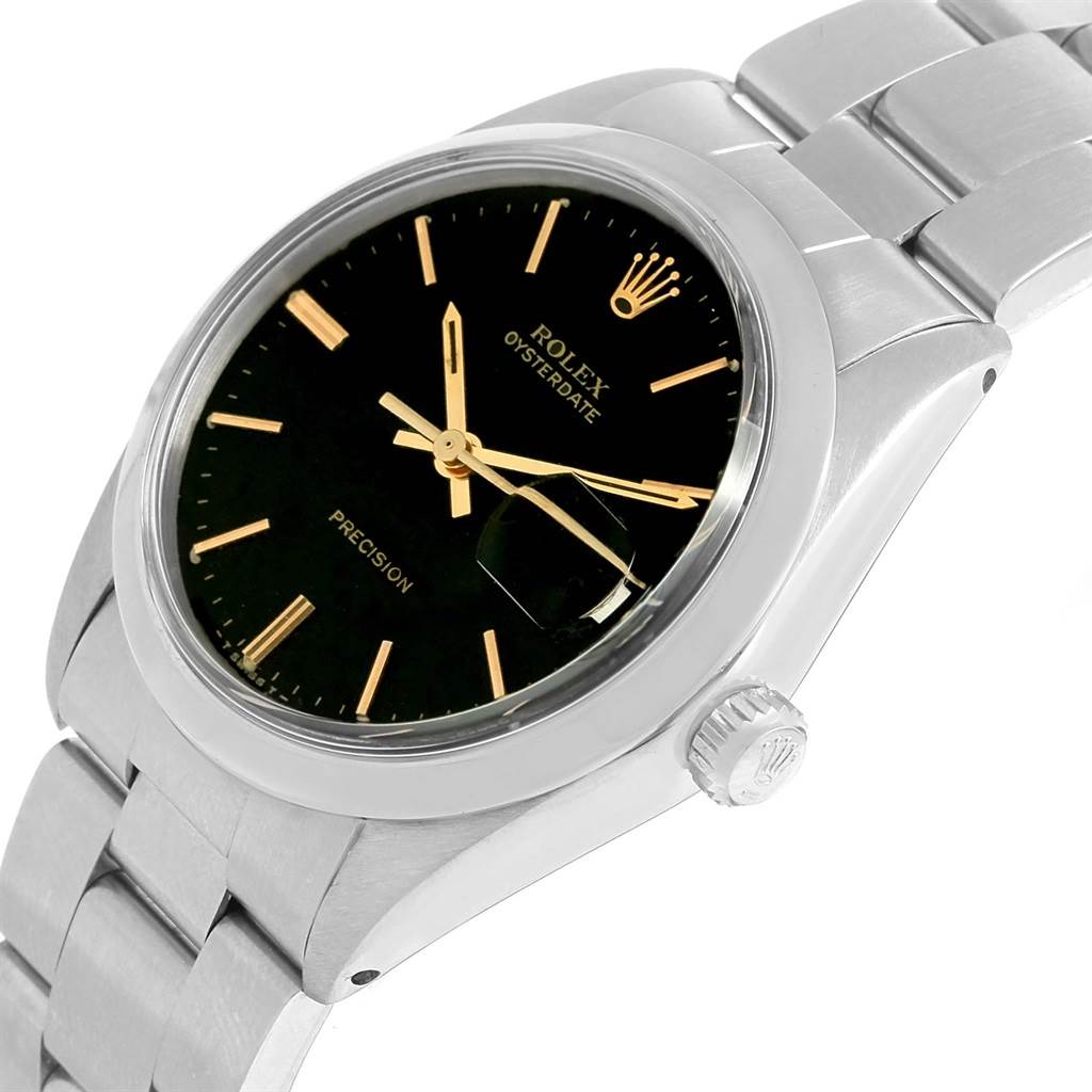 The Vintage Collection Rolex watch is shown at an angle highlighting its face, crown, and a portion of its stainless steel bracelet.