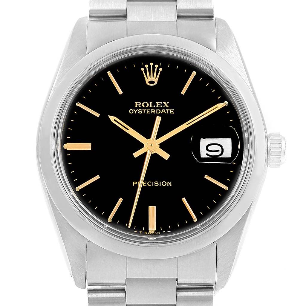 This image shows a front view of the Rolex Vintage Collection 6694 Men's Stainless Steel Black Dial 6694 Men's Stainless Steel Black Dial Oysterdate watch, highlighting the black dial, gold markers, and date window.
