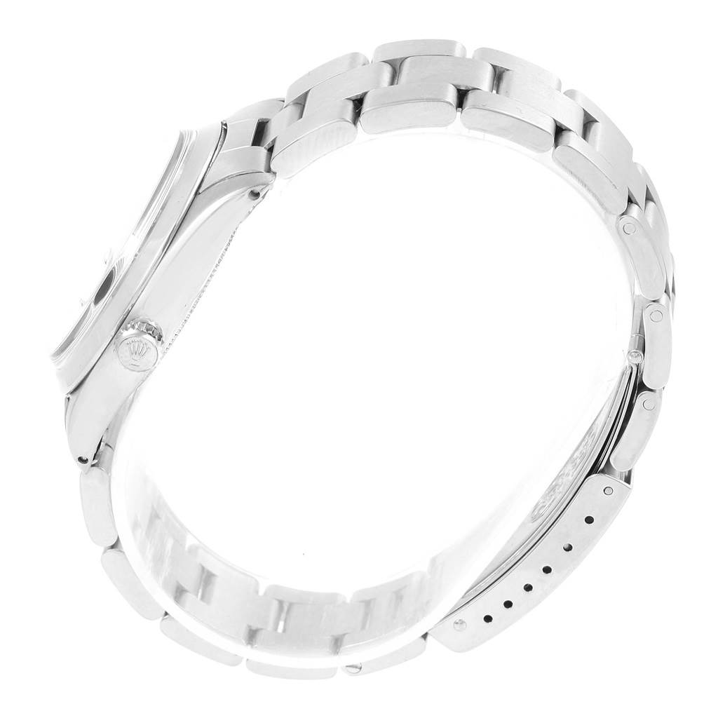 The image shows a side view of the Rolex Vintage Collection 6694 Men's Stainless Steel Black Dial 6694 Men's Stainless Steel Black Dial watch, highlighting its bracelet, crown, and clasp.