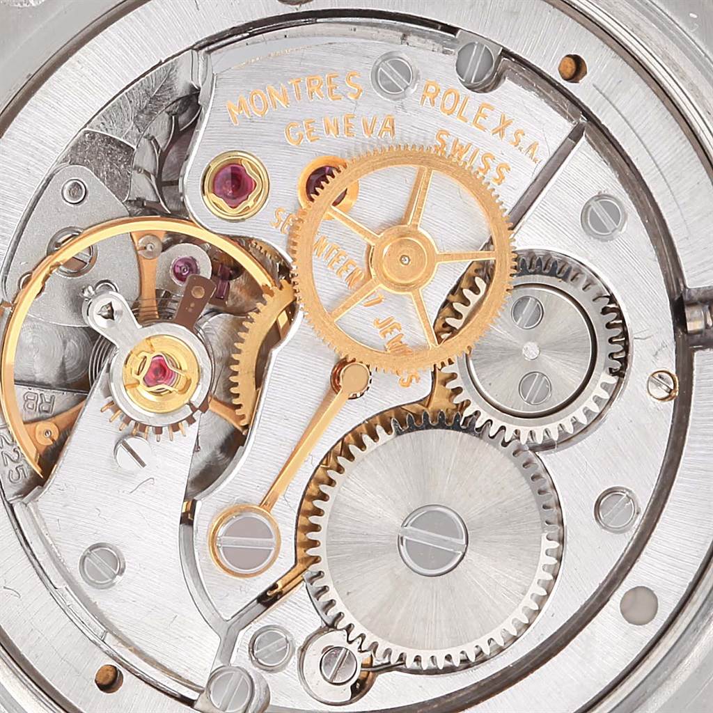 This is a close-up view of the movement inside a Vintage Collection model by Rolex, showcasing gears and internal mechanisms.