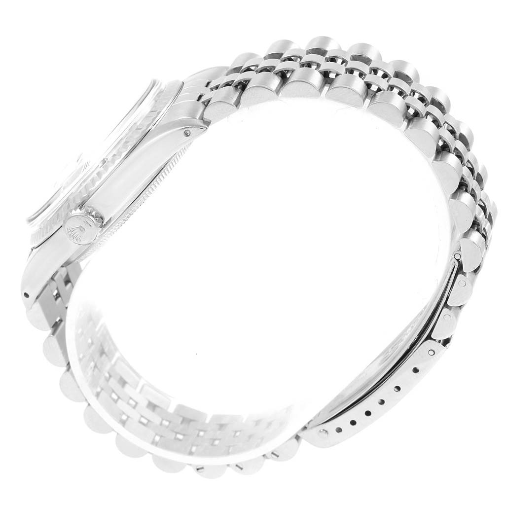 The image shows the side of the Rolex Vintage Collection 1601 Men's Stainless Steel Silver Dial 1601 Men's Stainless Steel Silver Dial watch, showcasing its bracelet and crown from an angled perspective.