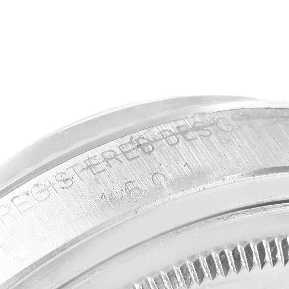This close-up image shows the engraved edge of the case back of the Rolex Vintage Collection 1601 Men's Stainless Steel Silver Dial 1601 Men's Stainless Steel Silver Dial model.