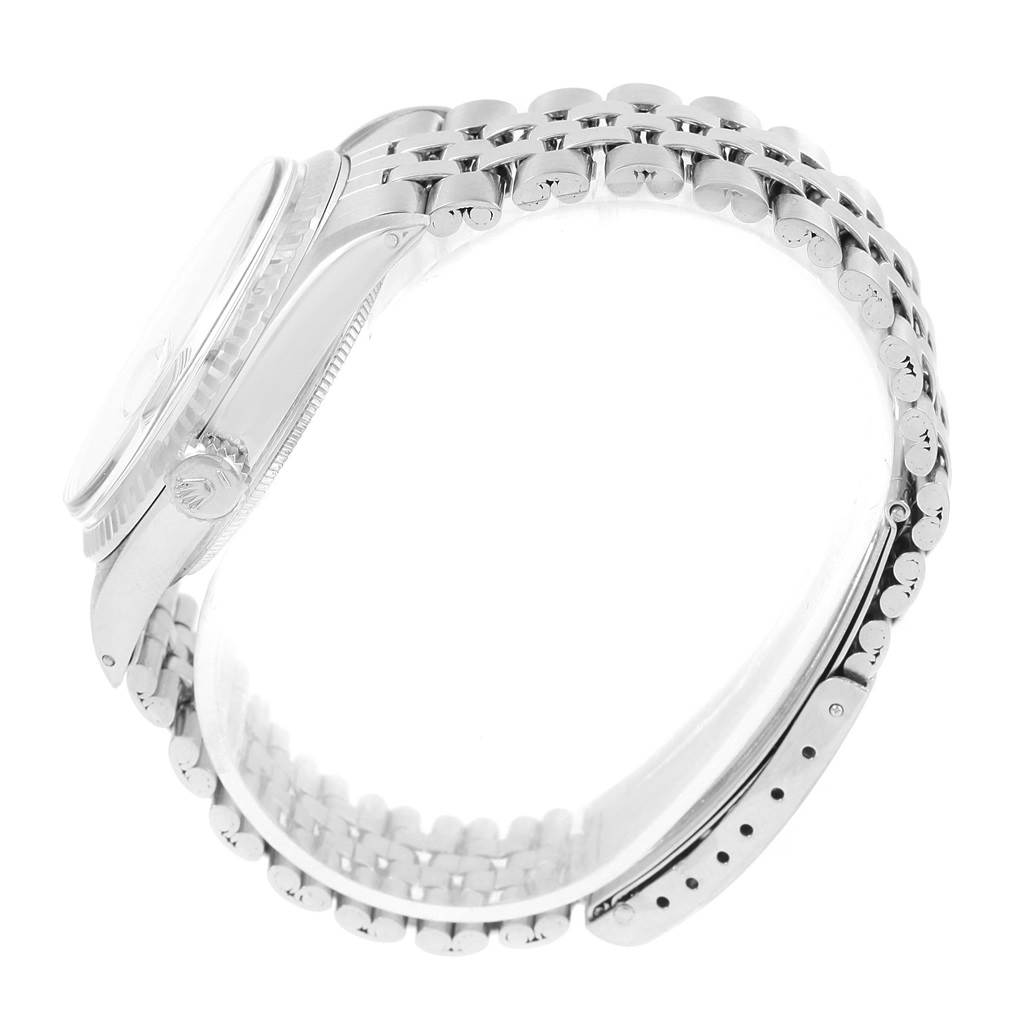 The image shows a side profile view of a Rolex Vintage Collection 1601 Men's Stainless Steel Silver Dial 1601 Men's Stainless Steel Silver Dial watch, highlighting its case, crown, and bracelet.