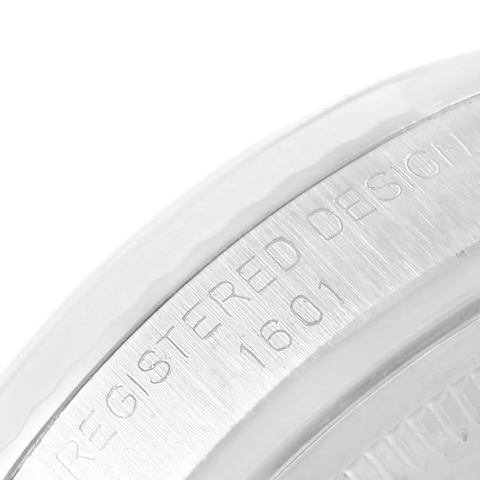 The image shows a close-up of the case back of a Rolex Vintage Collection 1601 Men's Stainless Steel Silver Dial 1601 Men's Stainless Steel Silver Dial model, highlighting the "REGISTERED DESIGN 1601" engraving.