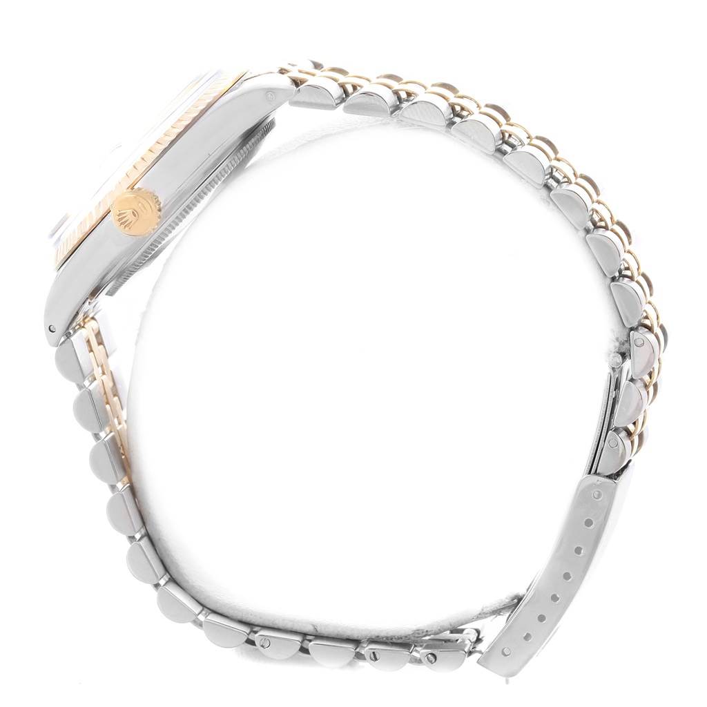 A side view of a Rolex Vintage Collection 16013 Men's Stainless Steel Silver Dial 16013 Men's Stainless Steel Silver Dial watch, showing the case, crown, and two-tone bracelet.