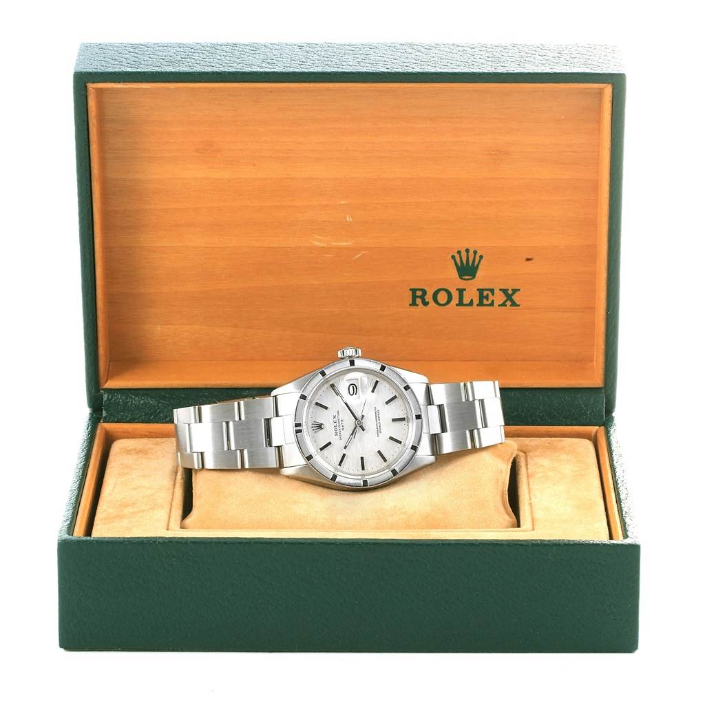 The image shows a Rolex Vintage Collection 1501 Men's Stainless Steel Silver Dial 1501 Men's Stainless Steel Silver Dial model watch, positioned upright inside an open green and wooden Rolex box.