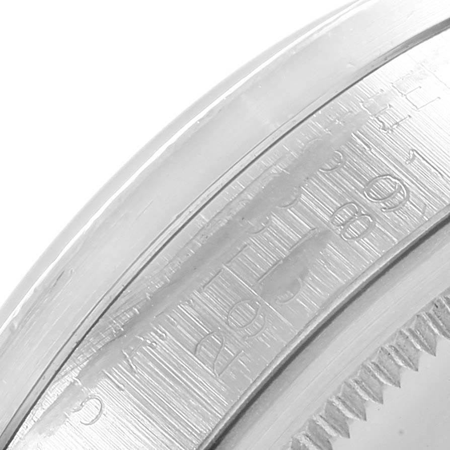 The image shows a close-up view of the bezel and part of the inner case of the Rolex Vintage Collection 1501 Men's Stainless Steel Silver Dial 1501 Men's Stainless Steel Silver Dial model.