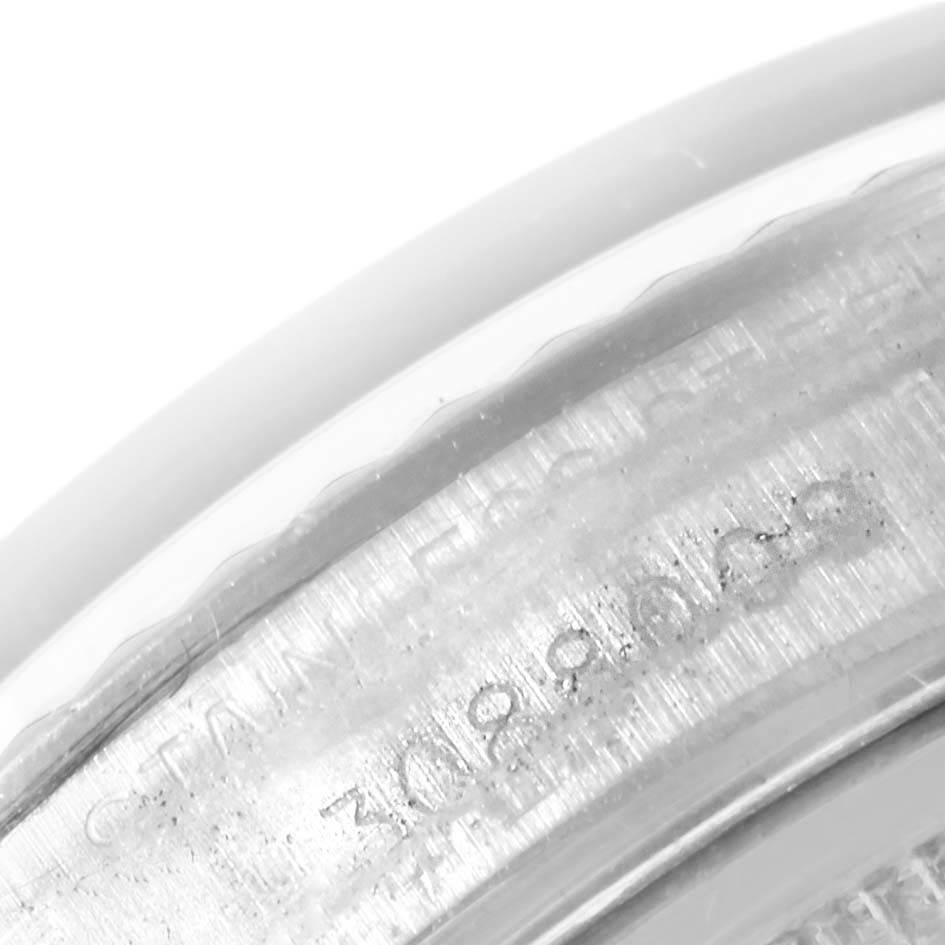 This image shows a close-up of the edge of the watch's case, featuring the serial number engraving on the Rolex Vintage Collection 1601 Men's Stainless Steel Silver Dial 1601 Men's Stainless Steel Silver Dial model.