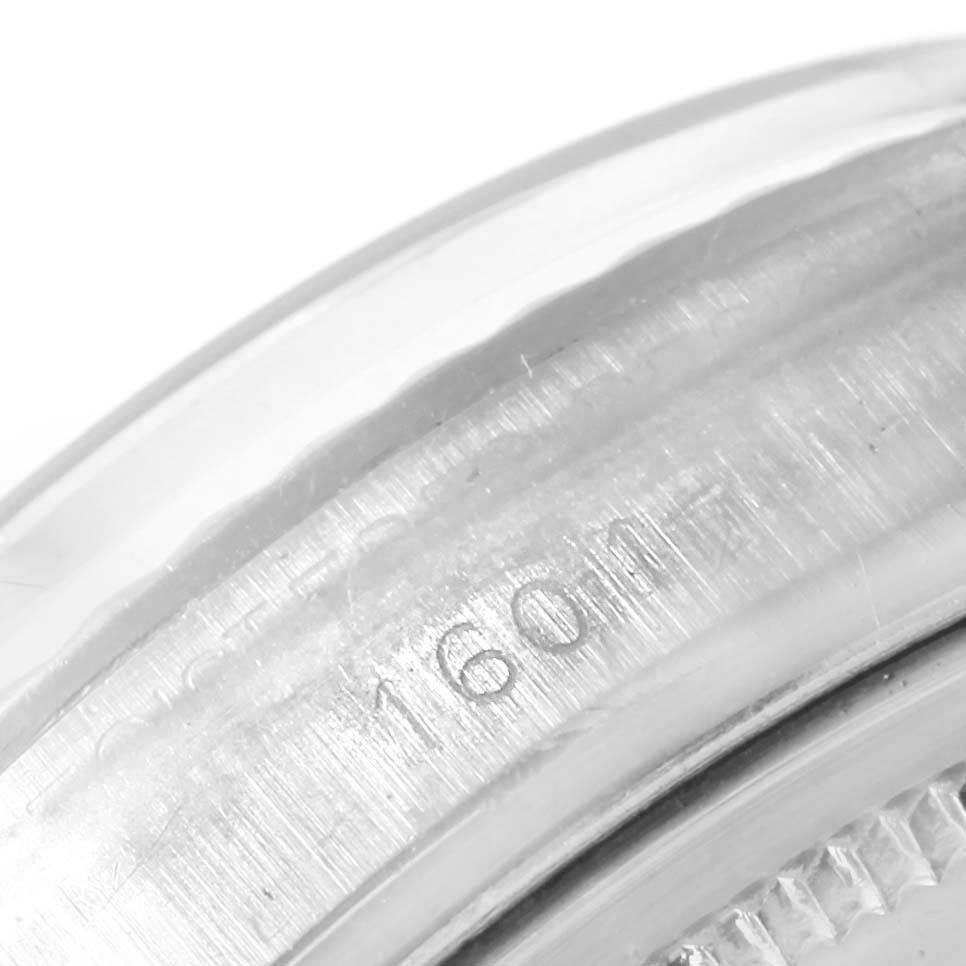 This close-up image shows the engraved inner bezel of a Rolex Vintage Collection 1601 Men's Stainless Steel Silver Dial 1601 Men's Stainless Steel Silver Dial watch.
