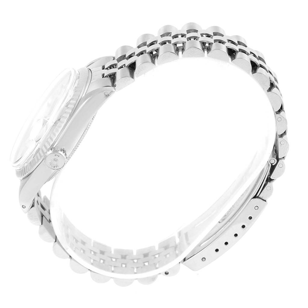 The image shows a side-angle view of a Rolex Vintage Collection 1601 Men's Stainless Steel Silver Dial 1601 Men's Stainless Steel Silver Dial watch, highlighting the bracelet, case, and crown.