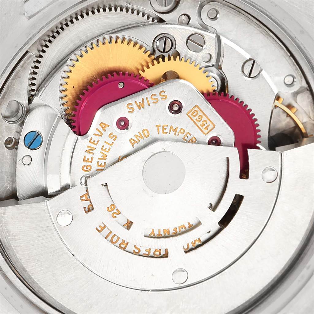 This image shows a close-up view of the internal mechanism of the Vintage Collection model by Rolex, including gears and inscriptions.