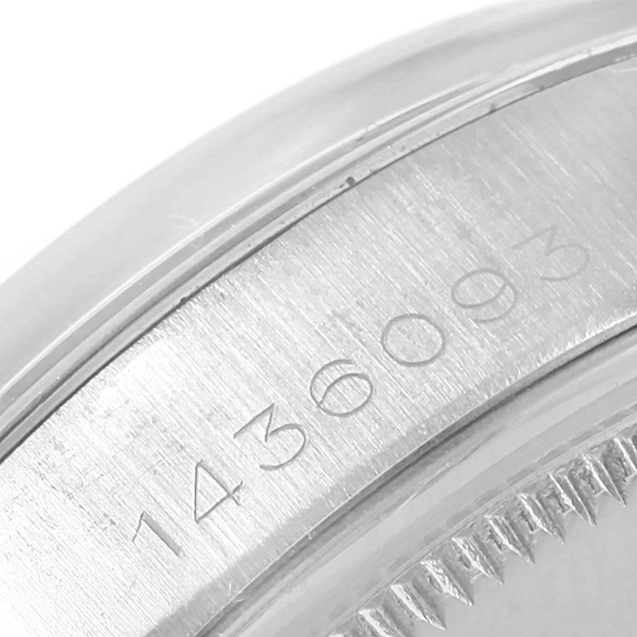 This close-up image of a Rolex Vintage Collection 1500 Men's Stainless Steel Silver Dial 1500 Men's Stainless Steel Silver Dial watch shows the serial number engraved on the side of the case.