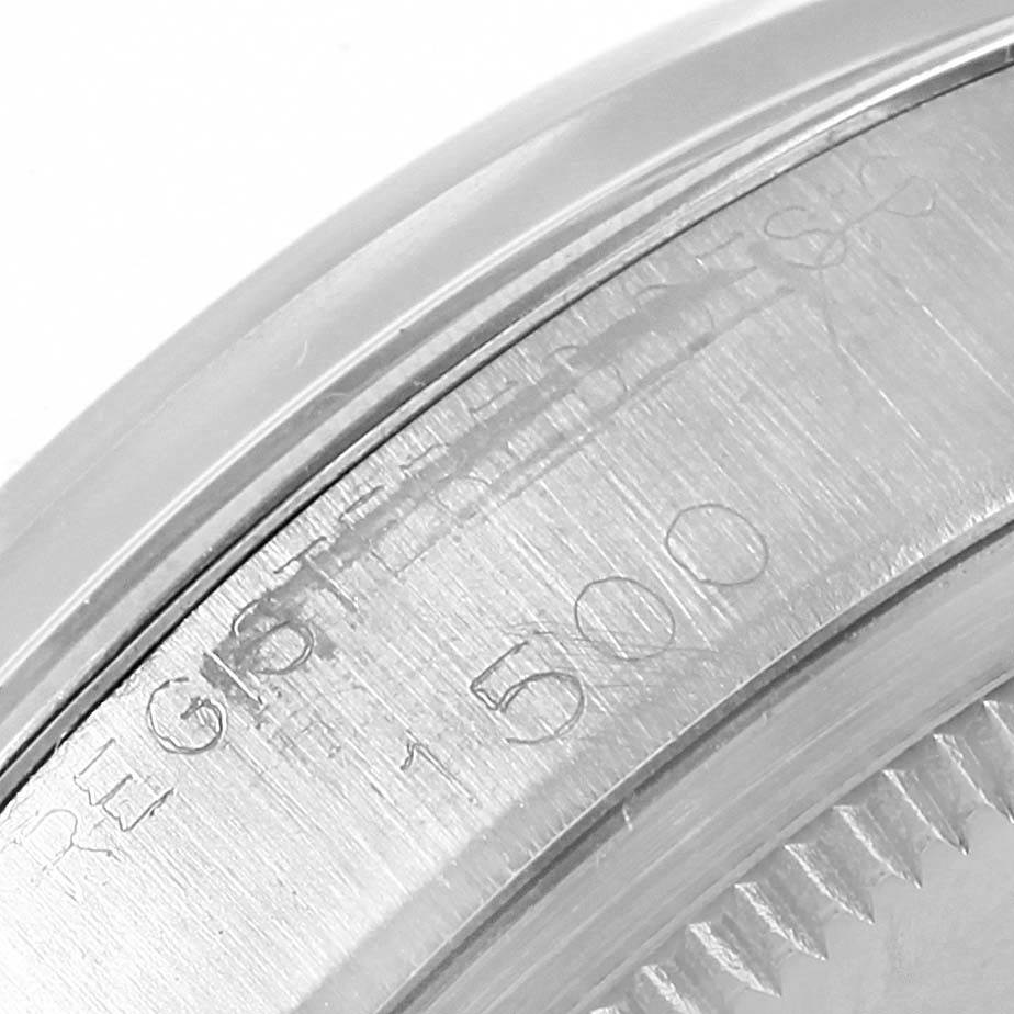 The image shows a close-up of the case back edge with engravings of the Vintage Collection model by Rolex.