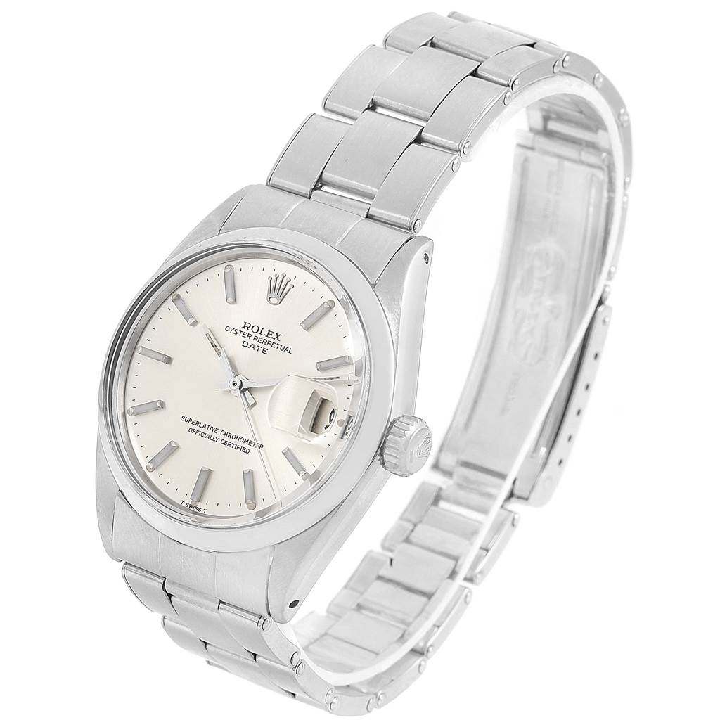 The image shows a Rolex Vintage Collection 1500 Men's Stainless Steel Silver Dial 1500 Men's Stainless Steel Silver Dial model watch at an angle displaying its face, crown, and stainless steel bracelet.
