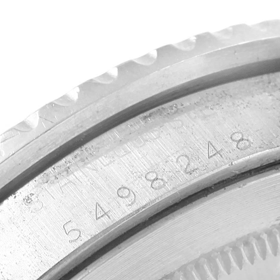 This image shows a close-up of the engraved serial number on the case of a Rolex Vintage Collection 1675 Men's Stainless Steel Black Dial 1675 Men's Stainless Steel Black Dial watch, revealing the bezel's edge.